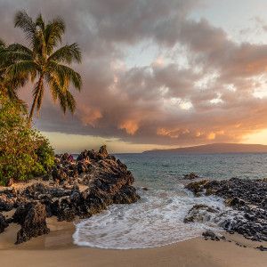 Image of serene tropical island sunset at a rocky shore with a small inlet and a palm tree in view for a hip hop rap beat titled all good