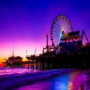 Image of Santa Monica Pier at dusk over exposed in purple with the ferris wheel in view for a hip hop rap beat titled plucky
